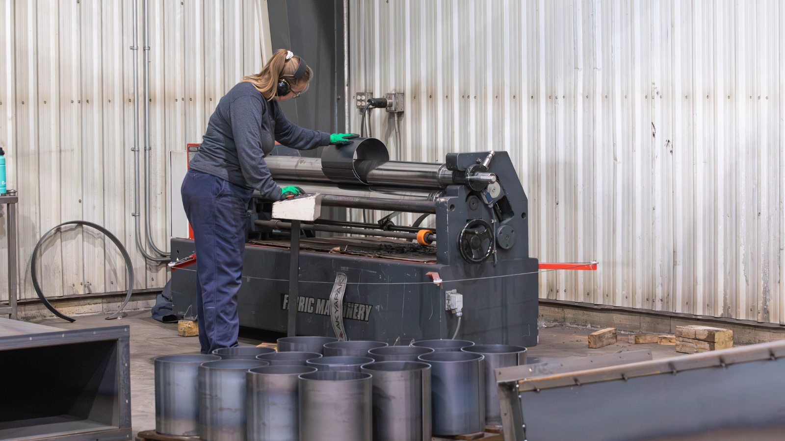 Dynamic Millwrights Inc. worker working with machine